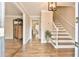 Inviting foyer with hardwood floors, a staircase, and elegant decor at 1830 Greystone Ct, Marietta, GA 30068