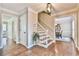 Welcoming foyer with hardwood floors, staircase, and neutral paint at 1830 Greystone Ct, Marietta, GA 30068