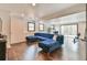 Open concept living room with recessed lights, hardwood flooring, and modern blue couch at 1830 Greystone Ct, Marietta, GA 30068