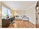 Comfortable living room with a white couch, desk, and large window at 1830 Greystone Ct, Marietta, GA 30068