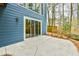 Back patio with sliding glass doors overlooking a wooded backyard at 1830 Greystone Ct, Marietta, GA 30068