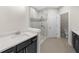 A sleek bathroom with a glass shower, modern fixtures, and stylish tiling at 2028 Holtz Ln, Atlanta, GA 30318