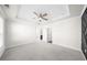 Bedroom with gray carpet, neutral walls, recessed lighting, and tray ceilings at 2028 Holtz Ln, Atlanta, GA 30318