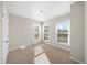 Bright bedroom featuring neutral carpeting, and three large windows for ample natural light at 2028 Holtz Ln, Atlanta, GA 30318