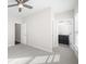 Bright bedroom featuring a ceiling fan, neutral walls, and an ensuite bathroom entrance at 2028 Holtz Ln, Atlanta, GA 30318