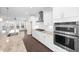 This modern kitchen features stainless steel appliances, gas range, and ample counter space at 2028 Holtz Ln, Atlanta, GA 30318