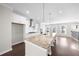 Modern kitchen featuring white cabinetry, stainless steel appliances, granite countertops, and a large island at 2028 Holtz Ln, Atlanta, GA 30318