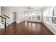 Living room with hardwood floors, a staircase, and many windows allowing natural light to illuminate the space at 2028 Holtz Ln, Atlanta, GA 30318