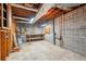 Unfinished basement featuring concrete floors, block walls, and exposed ceiling at 566 Hickory Hills Ct, Stone Mountain, GA 30083