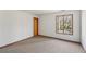 Bedroom with neutral carpeting, bright windows, and natural lighting at 566 Hickory Hills Ct, Stone Mountain, GA 30083