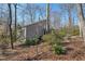 Scenic view of a home nestled among trees, showcasing its unique architectural style at 566 Hickory Hills Ct, Stone Mountain, GA 30083