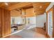 Inviting foyer with wood paneled walls, open staircase, and an abundance of natural light at 566 Hickory Hills Ct, Stone Mountain, GA 30083