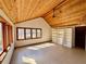 Bright living room with wood plank ceiling, large windows, and natural sunlight at 566 Hickory Hills Ct, Stone Mountain, GA 30083