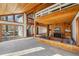 Open-concept living room features a wood-burning fireplace, built-ins and access to the loft and deck at 566 Hickory Hills Ct, Stone Mountain, GA 30083