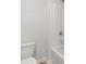 Bathroom featuring a white toilet and a tub-shower combo with a white tile surround at 98 Hampton Ter, Dallas, GA 30157