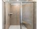 Walk-in shower boasting sleek glass doors and a comfortable built-in seat at 98 Hampton Ter, Dallas, GA 30157