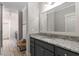 Bathroom featuring granite counters, lots of storage, and bench seating in a neutral color palette for a modern feel at 108 Brighton Blvd, Woodstock, GA 30188