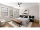 Serene bedroom with natural light and a comfy bench at the end of the bed at 108 Brighton Blvd, Woodstock, GA 30188