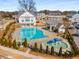 Aerial view of the large community pool and splash pad, enhanced by a clubhouse and landscaping at 108 Brighton Blvd, Woodstock, GA 30188