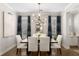 Elegant dining room with a modern chandelier and seating for six at 108 Brighton Blvd, Woodstock, GA 30188