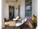 Cozy front porch featuring comfortable seating and decorative plants at 108 Brighton Blvd, Woodstock, GA 30188