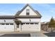 Exterior view of a home featuring a two-car garage with a private entry door at 108 Brighton Blvd, Woodstock, GA 30188