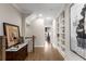 Hallway with hardwood floors, and built-in shelving at 108 Brighton Blvd, Woodstock, GA 30188