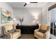 Cozy seating area with accent chairs and a black cabinet at 108 Brighton Blvd, Woodstock, GA 30188