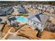 Aerial view of the community pool, clubhouse, and well-maintained landscaping at 108 Brighton Blvd, Woodstock, GA 30188