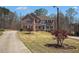 Traditional brick home with manicured lawn and mature trees in a desirable neighborhood at 1760 Carissa Dr, Conyers, GA 30094