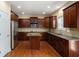 Well-equipped kitchen featuring granite countertops, custom cabinets, and stainless steel appliances at 1760 Carissa Dr, Conyers, GA 30094