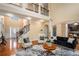 Elegant living room with hardwood floors, high ceilings, and abundant natural light at 1760 Carissa Dr, Conyers, GA 30094