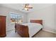 Bedroom featuring a comfortable bed, a window, and a neutral color scheme at 214 White Cloud Run, Canton, GA 30114