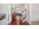 Bright foyer featuring hardwood floors, natural light, and staircase view to the living room at 214 White Cloud Run, Canton, GA 30114