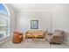 Cozy living room with neutral tones, comfortable seating, and ample natural light at 214 White Cloud Run, Canton, GA 30114