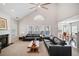 Bright open living room with high ceilings and large windows, seamlessly connecting to the dining area at 214 White Cloud Run, Canton, GA 30114