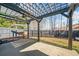 Backyard covered patio features modern pergola, fan, and swing, providing ample space for relaxing or entertaining at 214 White Cloud Run, Canton, GA 30114