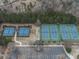 Overhead view of community tennis courts with a parking lot and walking trails at 214 White Cloud Run, Canton, GA 30114