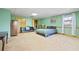 Large basement bedroom with plush carpeting, ample closet space, and natural light at 2499 E Maddox Rd, Buford, GA 30519