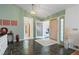 Foyer with slate floors, decorative light fixture, and view into other rooms at 2499 E Maddox Rd, Buford, GA 30519