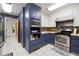 Kitchen with stainless steel appliances, two-tone cabinets, and storage at 2499 E Maddox Rd, Buford, GA 30519