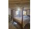 Bedroom with wood-look ceiling and a comfortable bed, brightened by natural light at 2540 Marsha Cir, Cumming, GA 30041