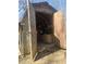 Interior of a shed with open doors and a variety of stored items at 2540 Marsha Cir, Cumming, GA 30041