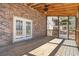 This cozy back porch features rustic charm with a wooden ceiling, fan, and open views of the yard at 3640 Hickory Se Cir, Smyrna, GA 30080