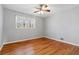 Bedroom with hardwood flooring, neutral walls, and double windows providing natural light at 3640 Hickory Se Cir, Smyrna, GA 30080