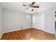 Bedroom with hardwood flooring, double door closet, and window for natural light at 3640 Hickory Se Cir, Smyrna, GA 30080