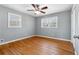 Well-lit bedroom features hardwood floors, windows, and closet space at 3640 Hickory Se Cir, Smyrna, GA 30080