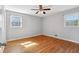 A light-filled bedroom features hardwood floors and neutral color palette at 3640 Hickory Se Cir, Smyrna, GA 30080