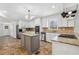 Modern kitchen with stainless steel appliances, granite countertops, tile backsplash, and a center island at 3640 Hickory Se Cir, Smyrna, GA 30080