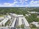 Stunning aerial view showcases modern townhomes with lush greenery and a vibrant cityscape at 201 New St # 2301, Decatur, GA 30030